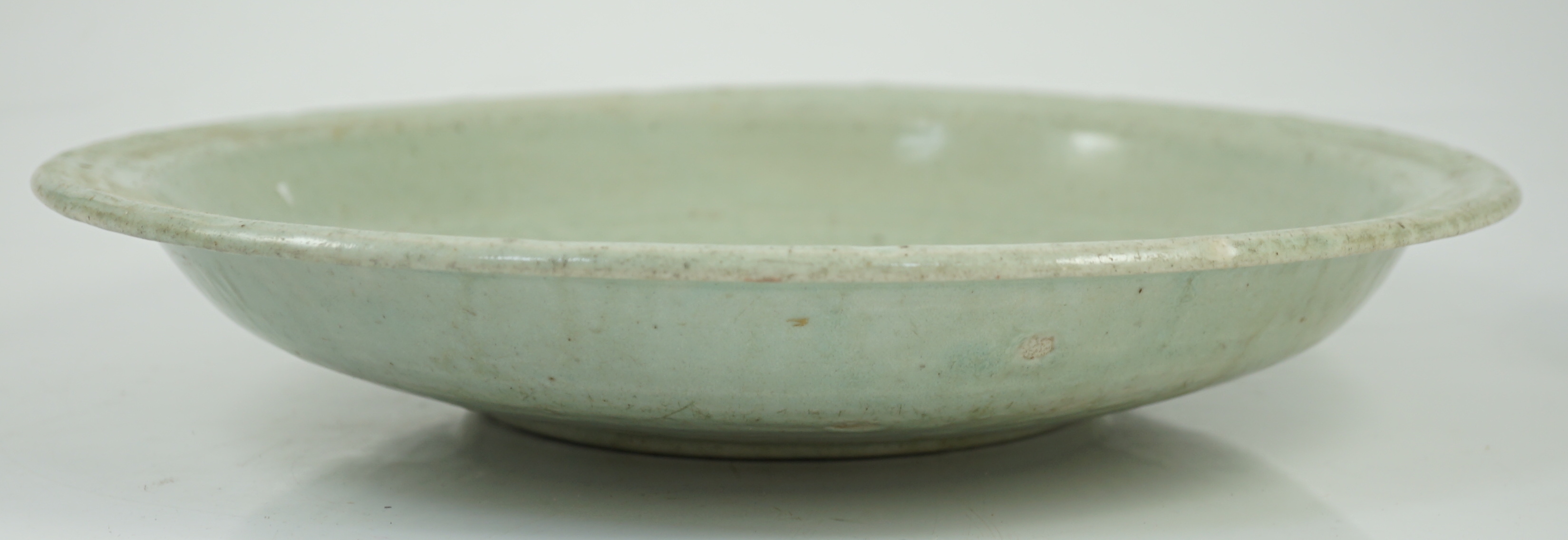 A Chinese Longquan celadon dish, Yuan-Ming dynasty, 13th/14th century, some faults